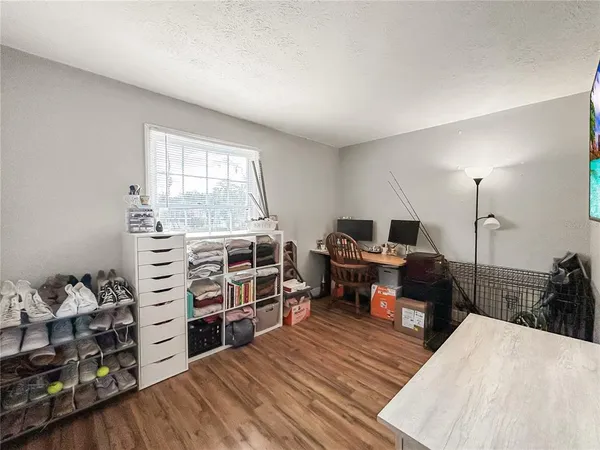 a view of a livingroom with a furniture and wooden floor