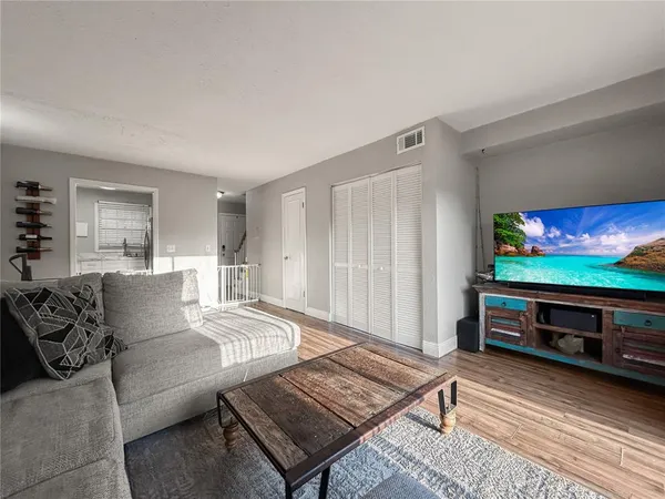a view of a livingroom with furniture and wooden floor