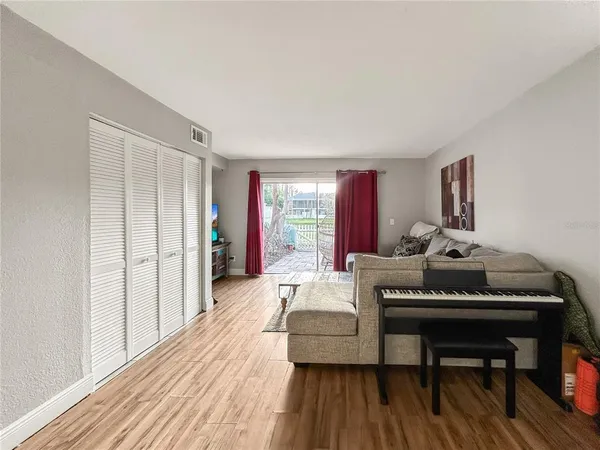 a kitchen with stainless steel appliances granite countertop white cabinets and a stove top oven