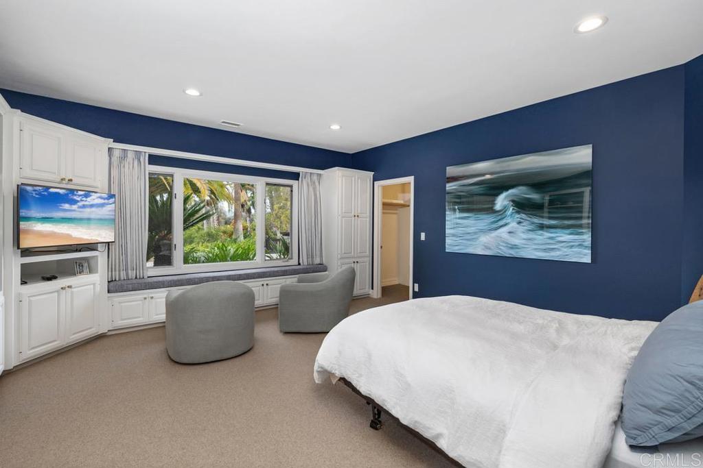 4715 La Noria Rancho Santa Fe, CA 92067 - Photo 14 of 26 a bedroom with a large bed and a large window