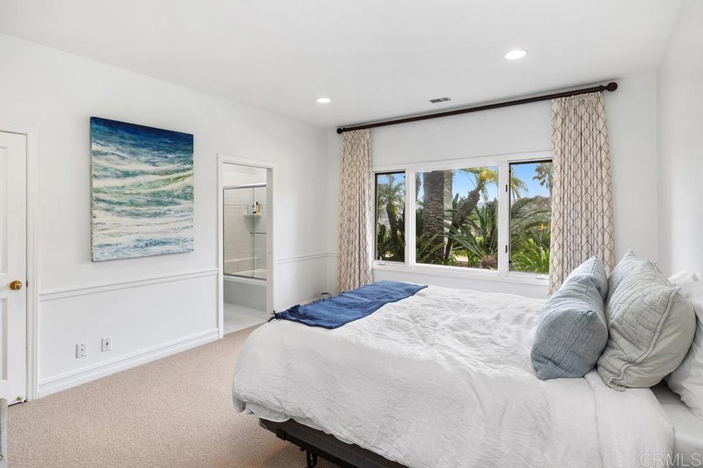 4715 La Noria Rancho Santa Fe, CA 92067 - Photo 16 of 26 a bedroom with a large bed and a large window
