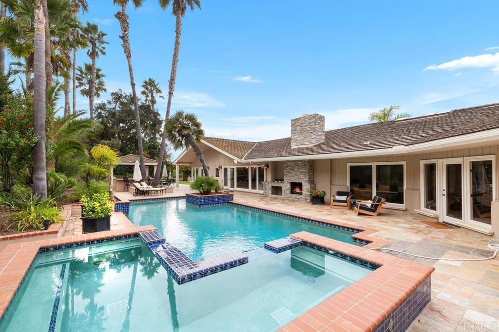 4715 La Noria Rancho Santa Fe, CA 92067 - Photo 18 of 26 a swimming pool with outdoor seating and yard