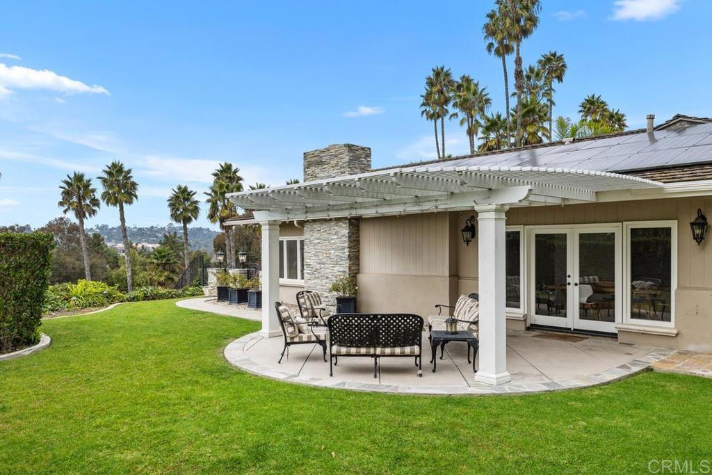 4715 La Noria Rancho Santa Fe, CA 92067 - Photo 20 of 26 a view of a house with backyard porch and sitting area