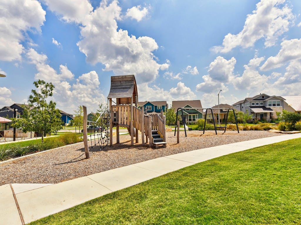9015 Cattle Baron Path, Unit 2003 Austin, TX 78747 - Photo 26 of 31 a view of a park with swings