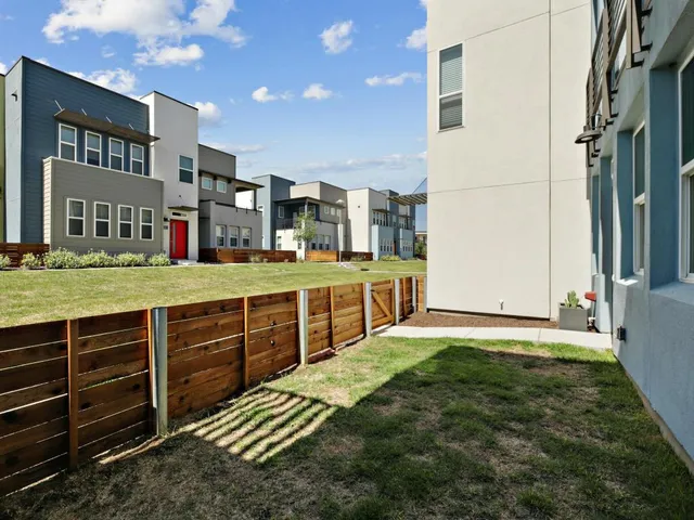 a front view of a building with a yard