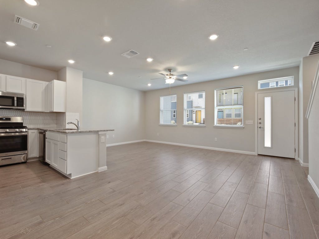 9015 Cattle Baron Path, Unit 2003 Austin, TX 78747 - Photo 7 of 31 a view of kitchen with window and wooden floor
