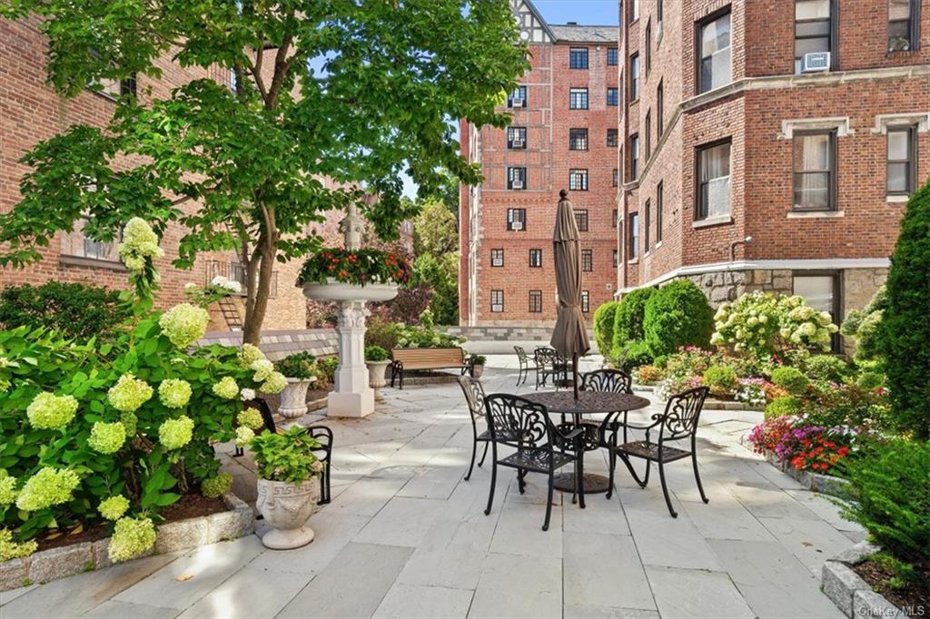 31 Pondfield Road, Unit 46 Bronxville, NY 10708 - Photo 11 of 15 a view of a patio with plants and flowers