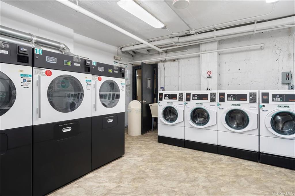 31 Pondfield Road, Unit 46 Bronxville, NY 10708 - Photo 10 of 15 a utility room with dryer and washer