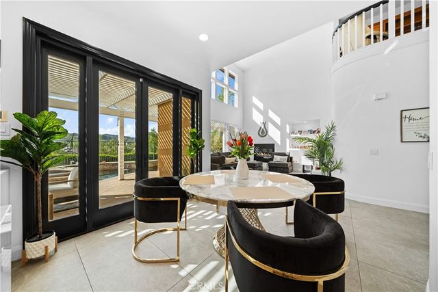 a dining room with furniture and window