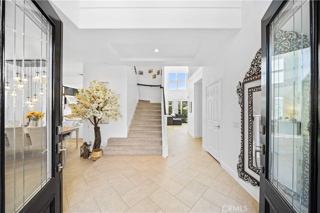 a view of entryway with a chandelier and living room