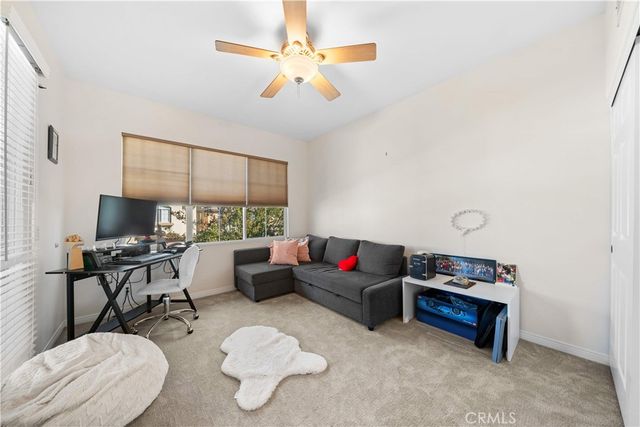 a bathroom with a sink mirror and a bathtub
