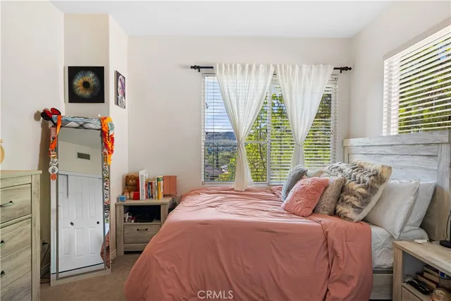 a bathroom with a toilet a sink a mirror a shower and vanity