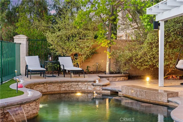 an aerial view of residential house with pool