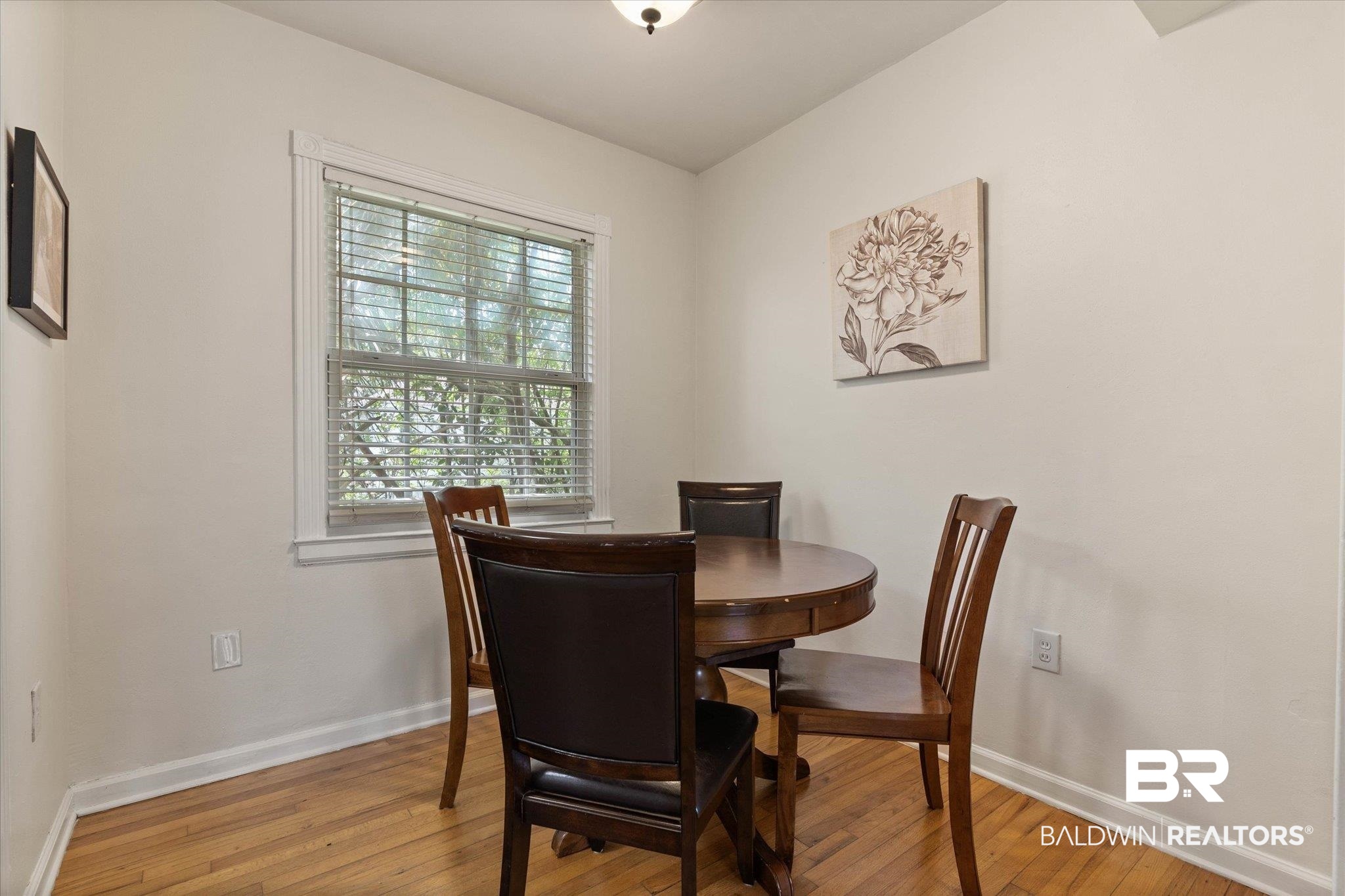 214 Upham Street, Unit 18C Mobile, AL 36607 - Photo 10 of 35 Dining space with light wood-style floors and baseboards