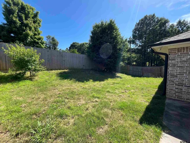 a view of a backyard with a garden