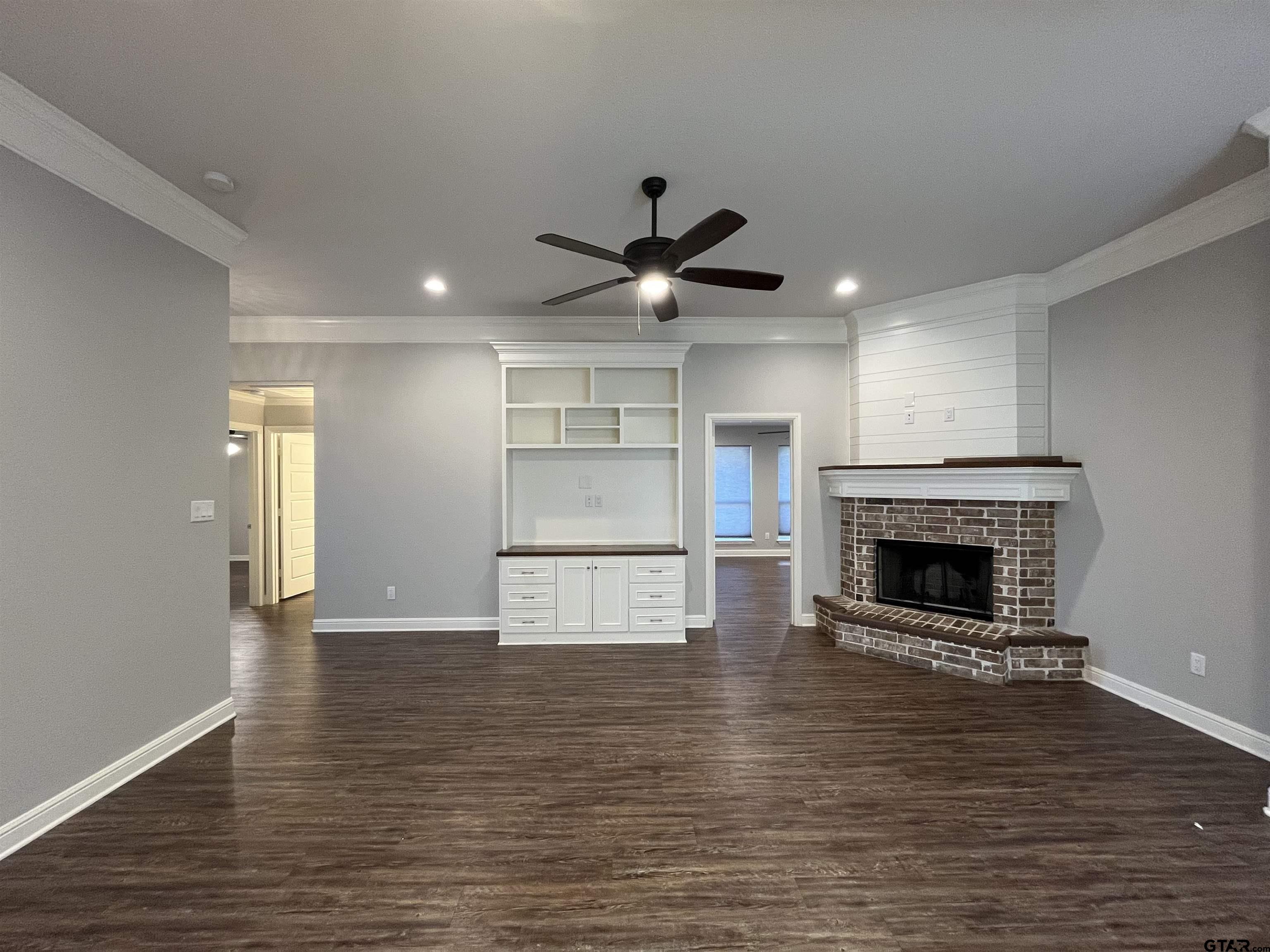 5429 Meadow Ridge Drive Flint, TX 75762 - Photo 5 of 24 a view of an empty room with a fireplace and a window