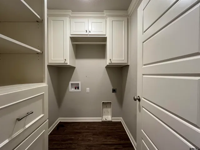 a view of kitchen with wooden floor and electronic appliances