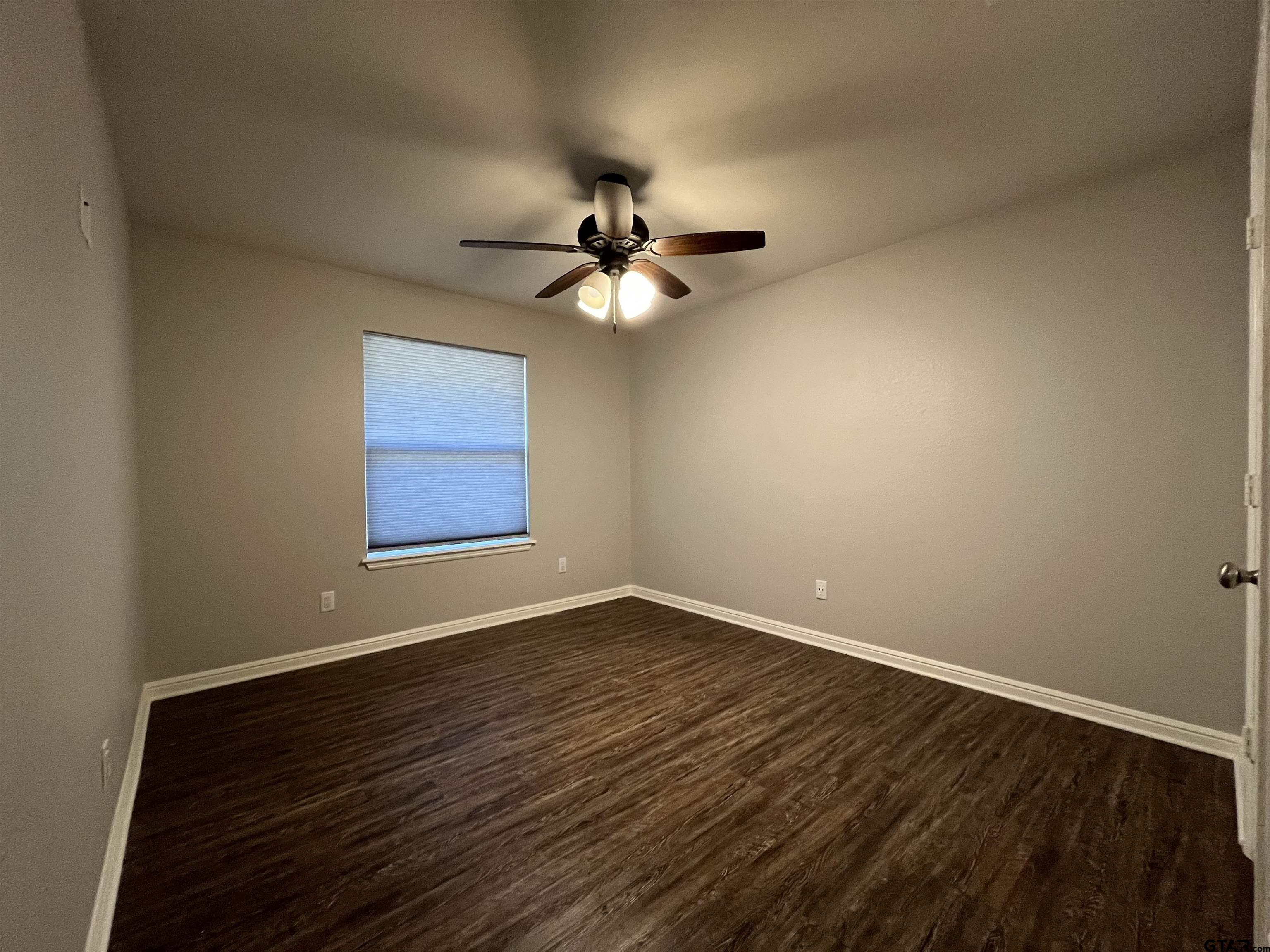 5429 Meadow Ridge Drive Flint, TX 75762 - Photo 9 of 24 wooden floor in an empty room with a window