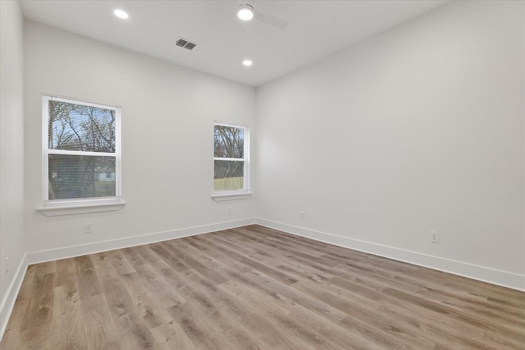 1334 Grant Street Dallas, TX 75203 - Photo 13 of 21 an empty room with windows