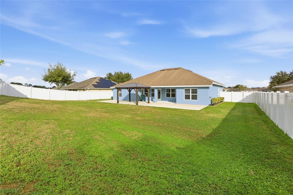 4863 Southwest 63rd Street Ocala, FL 34474 - Photo 34 of 41 a view of a house with a big yard