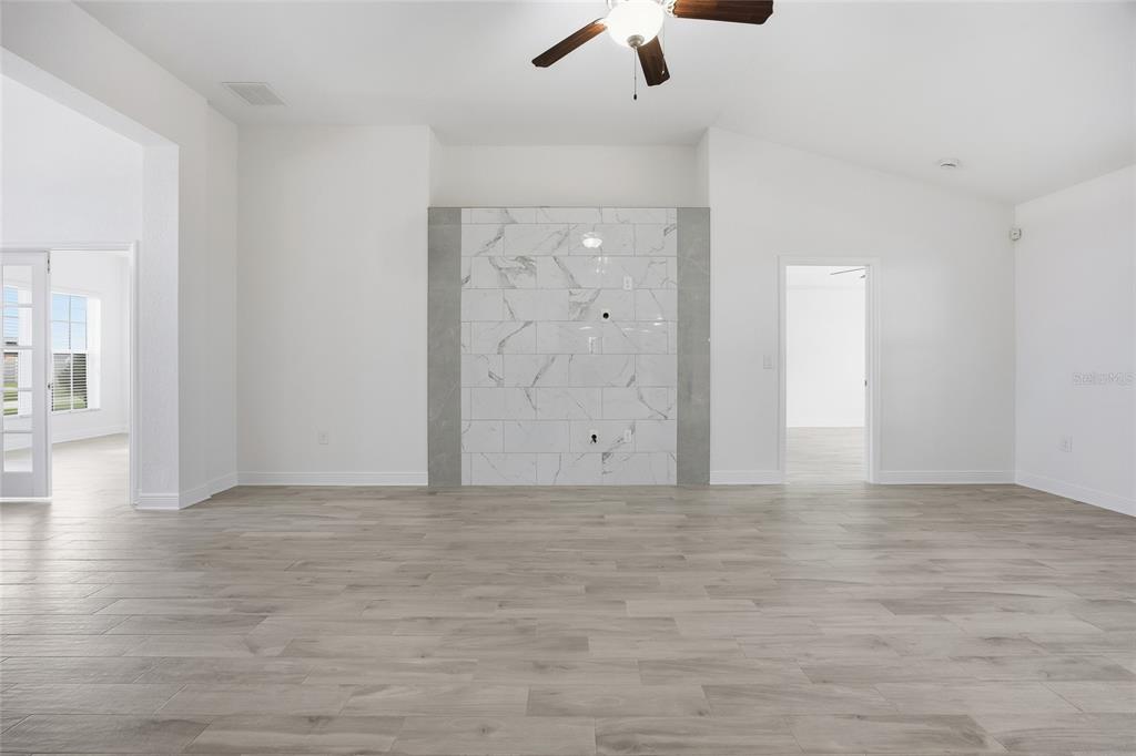 4863 Southwest 63rd Street Ocala, FL 34474 - Photo 8 of 41 wooden floor in an empty room
