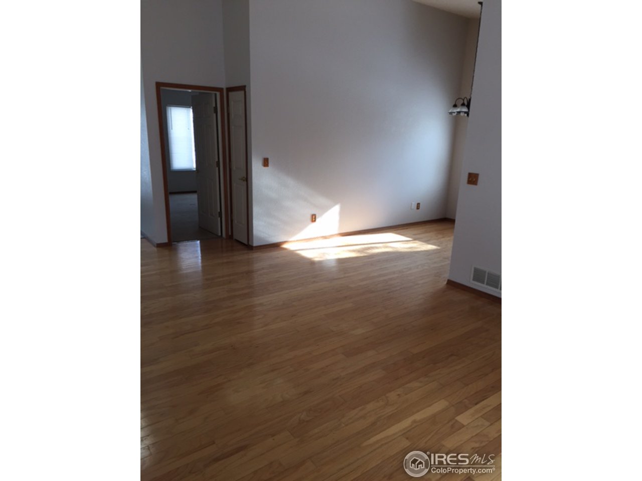 3335 Apollo Court Fort Collins, CO 80526 - Photo 9 of 10 a view of empty room with wooden floor
