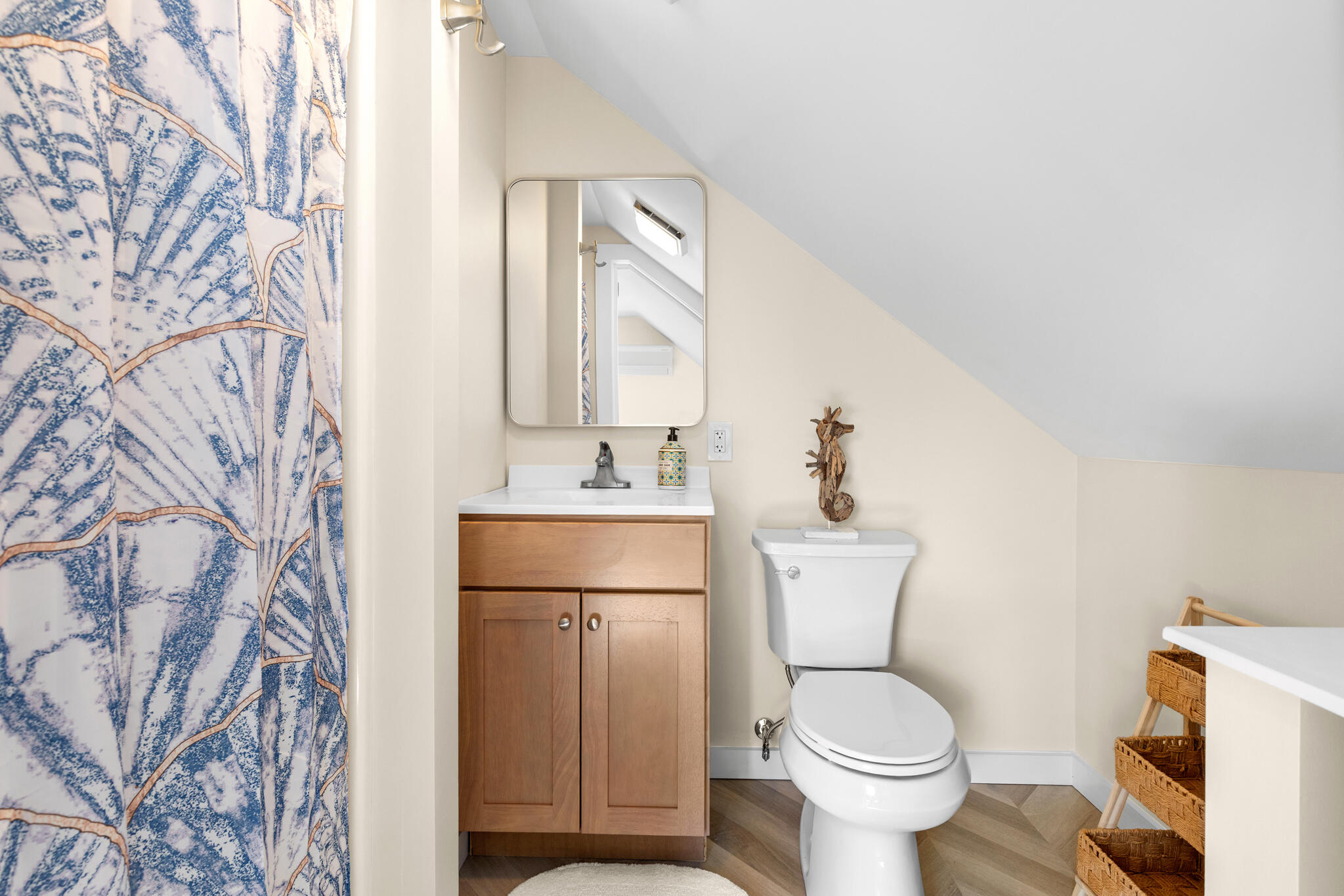 1295 Massasoit Road Eastham, MA 02642 - Photo 32 of 32 a bathroom with a toilet sink and mirror