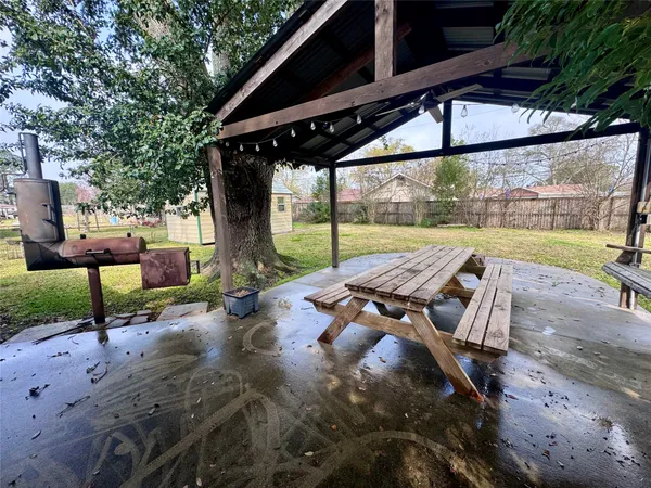 a view of a patio with a table chairs and a patio
