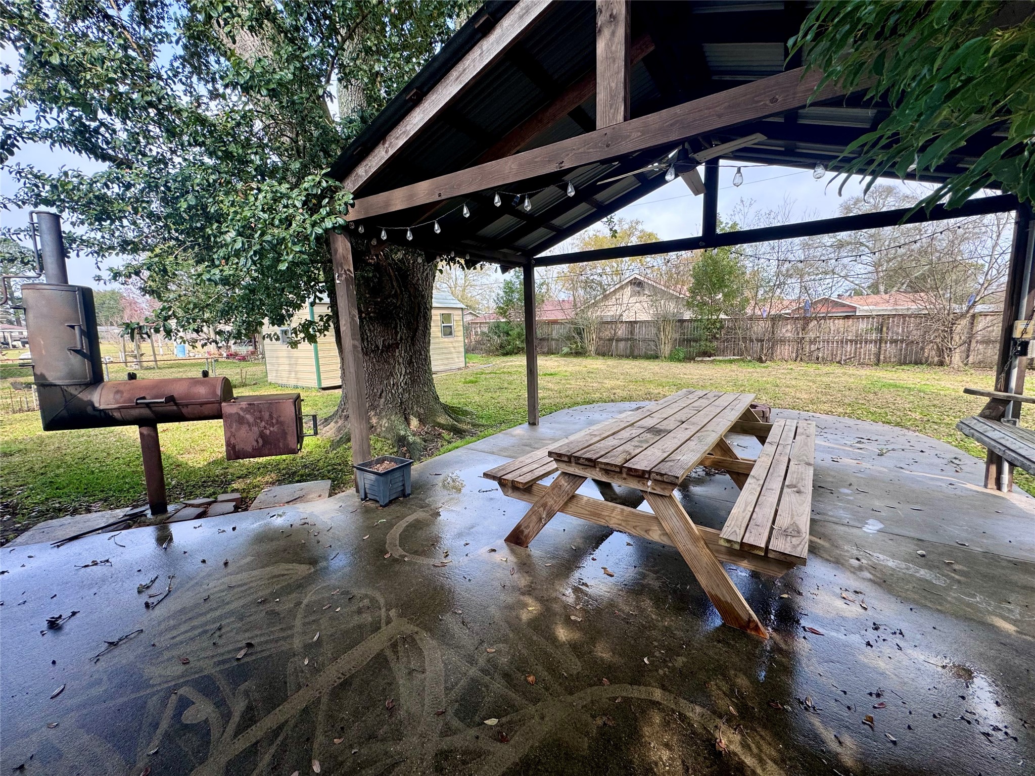 345 Rachal Avenue Bridge City, TX 77611 - Photo 21 of 25 a view of a patio with a table chairs and a patio