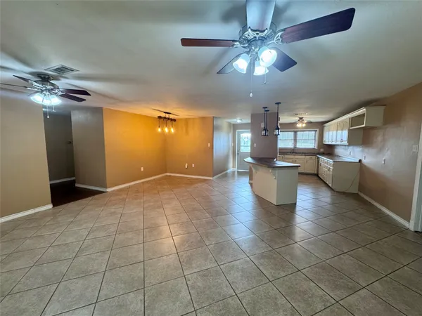 a view of a livingroom with a kitchen