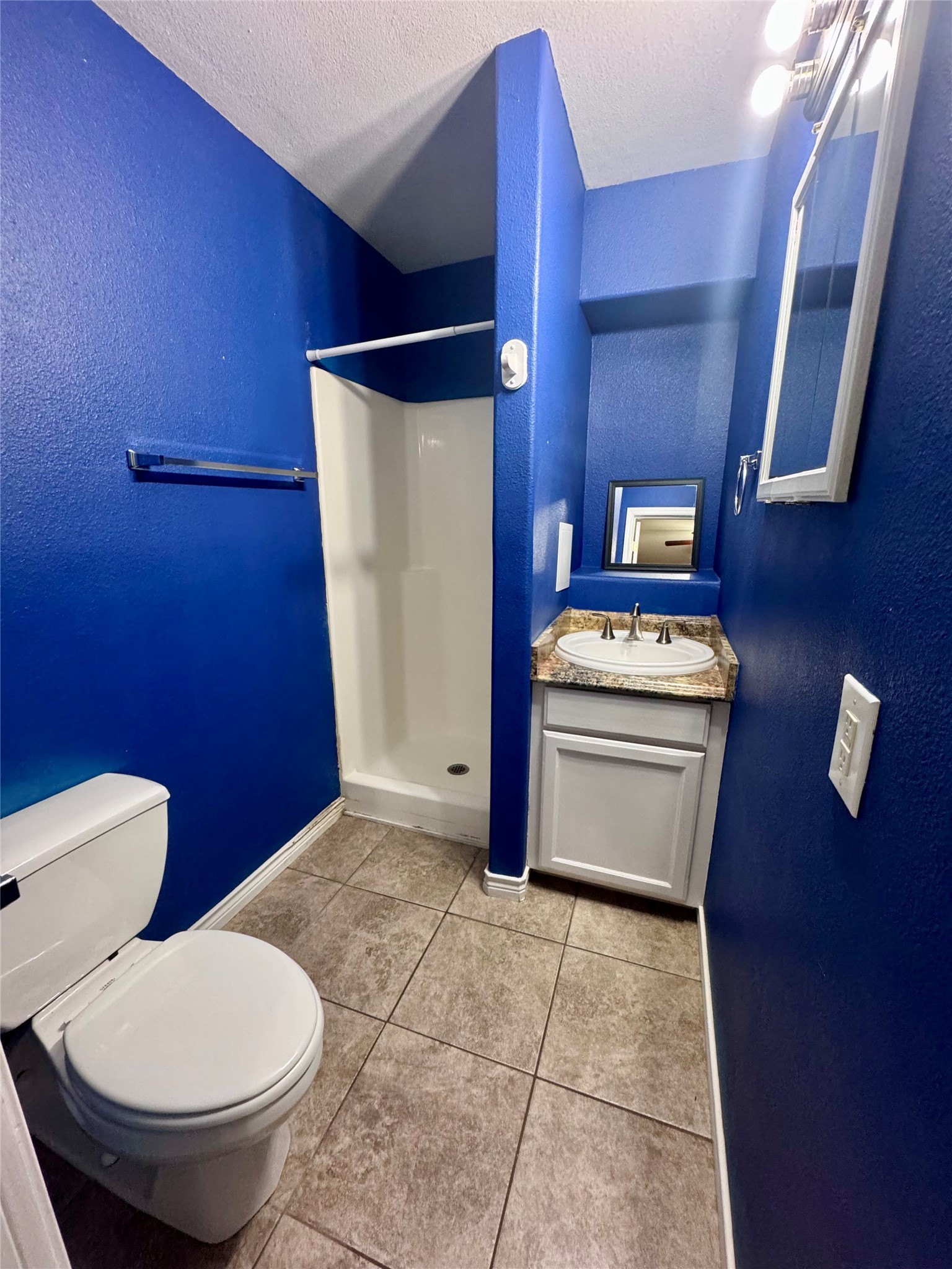 345 Rachal Avenue Bridge City, TX 77611 - Photo 10 of 25 a bathroom with a toilet and a shower