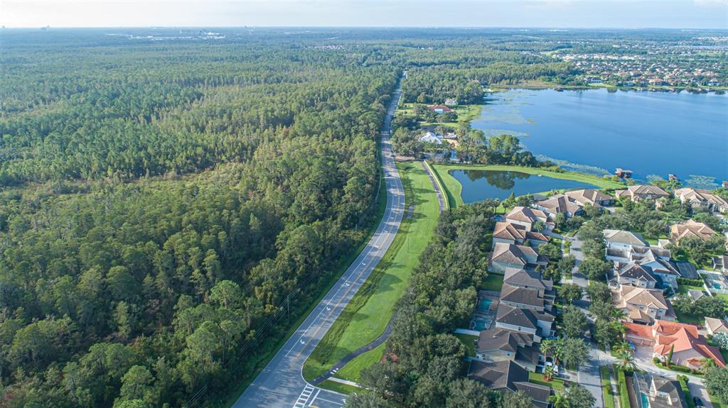 7545 Ficquette Road Windermere, FL 34786 - Photo 17 of 23 an aerial view of a house with a yard and lake view