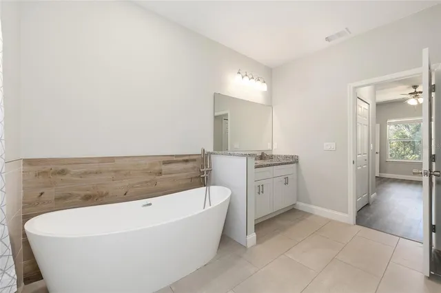 a bathroom with a bathtub and a sink