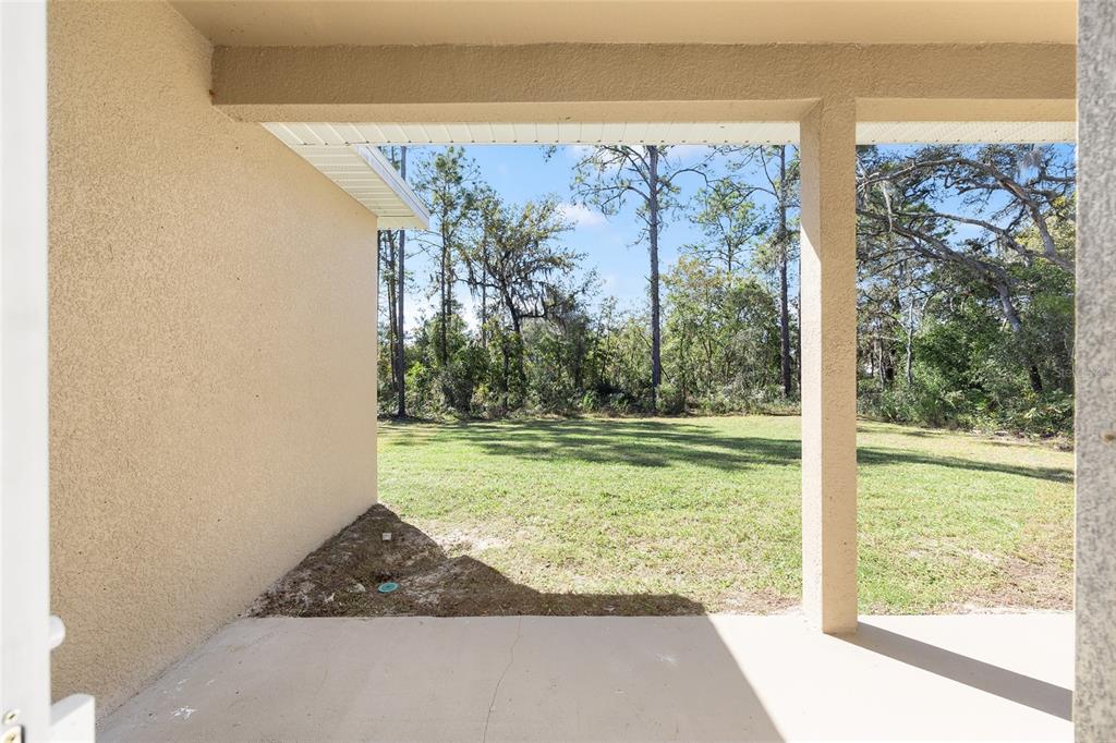 5998 Southwest 154th Street Road Ocala, FL 34473 - Photo 34 of 38 a view of a porch with a yard