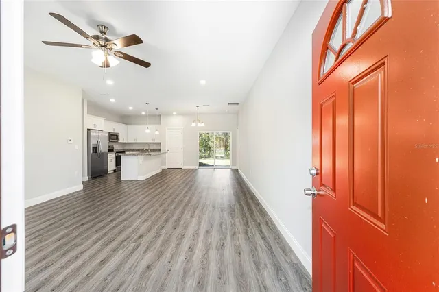 a view of kitchen with cabinets and wooden floor