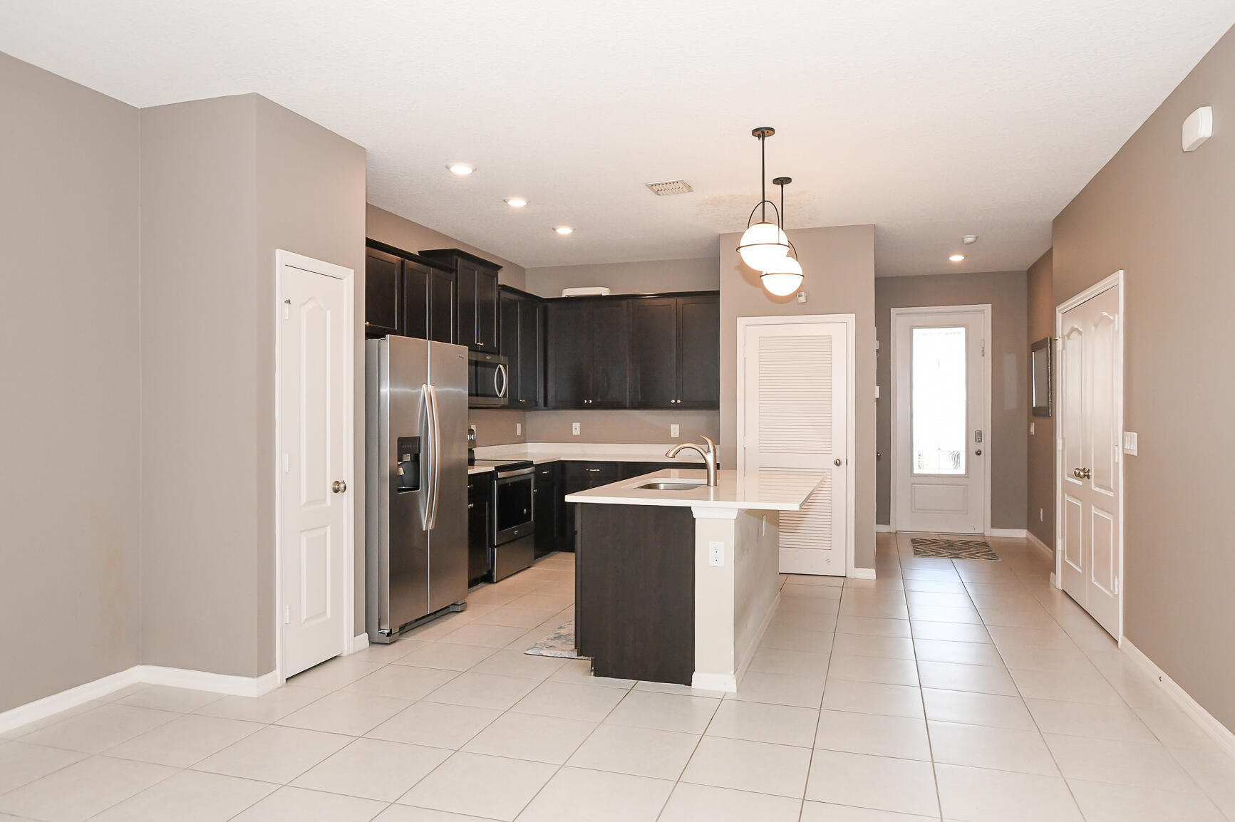 1618 Merriment Way Fort Pierce, FL 34947 - Photo 5 of 32 Entry/Kitchen
