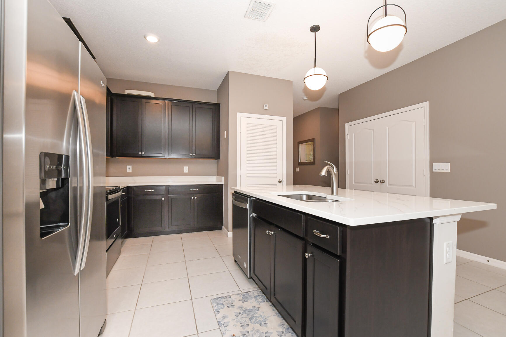 1618 Merriment Way Fort Pierce, FL 34947 - Photo 8 of 32 Kitchen/Laundry