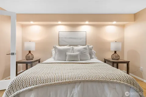 a bedroom with a bed and a table