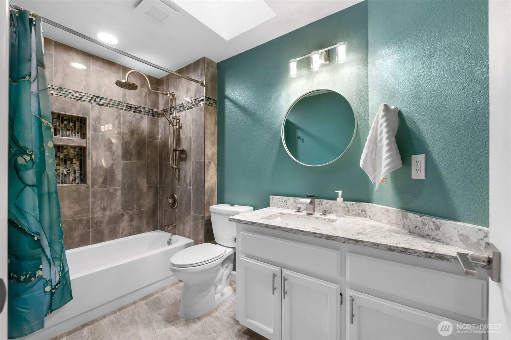 9220 78th Street Southwest Lakewood, WA 98498 - Photo 23 of 40 a bathroom with a sink a toilet and a mirror