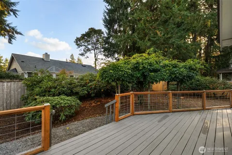 a view of deck with wooden floor and fence