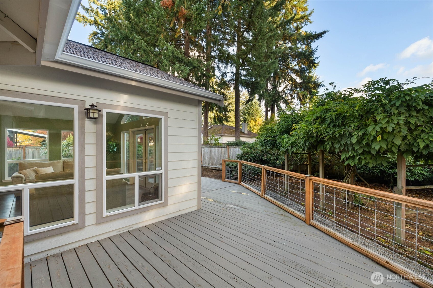 9220 78th Street Southwest Lakewood, WA 98498 - Photo 30 of 40 a view of a roof deck with wooden floor and fence