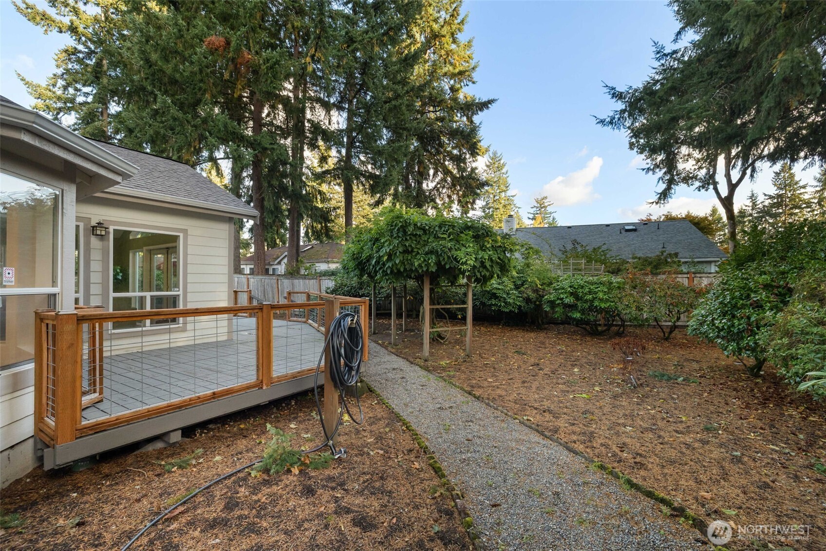9220 78th Street Southwest Lakewood, WA 98498 - Photo 33 of 40 a view of backyard with outdoor seating and covered with trees