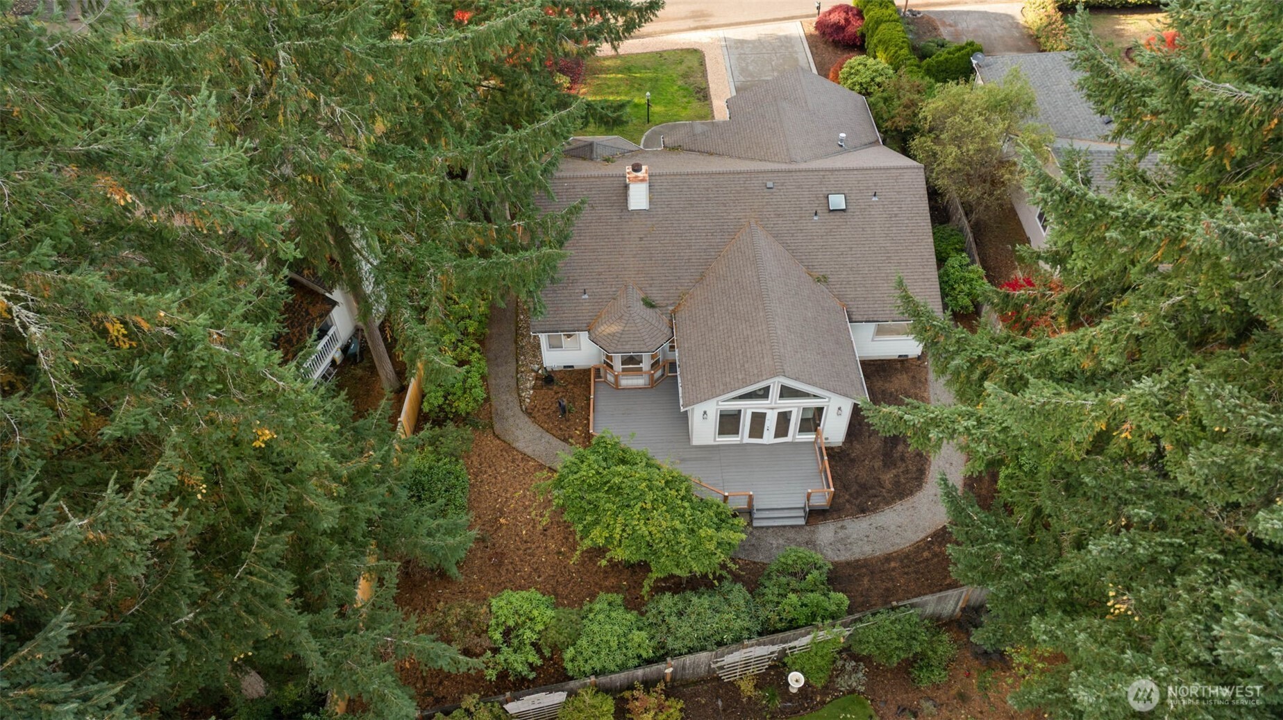 9220 78th Street Southwest Lakewood, WA 98498 - Photo 40 of 40 an aerial view of a house with a yard and trees all around