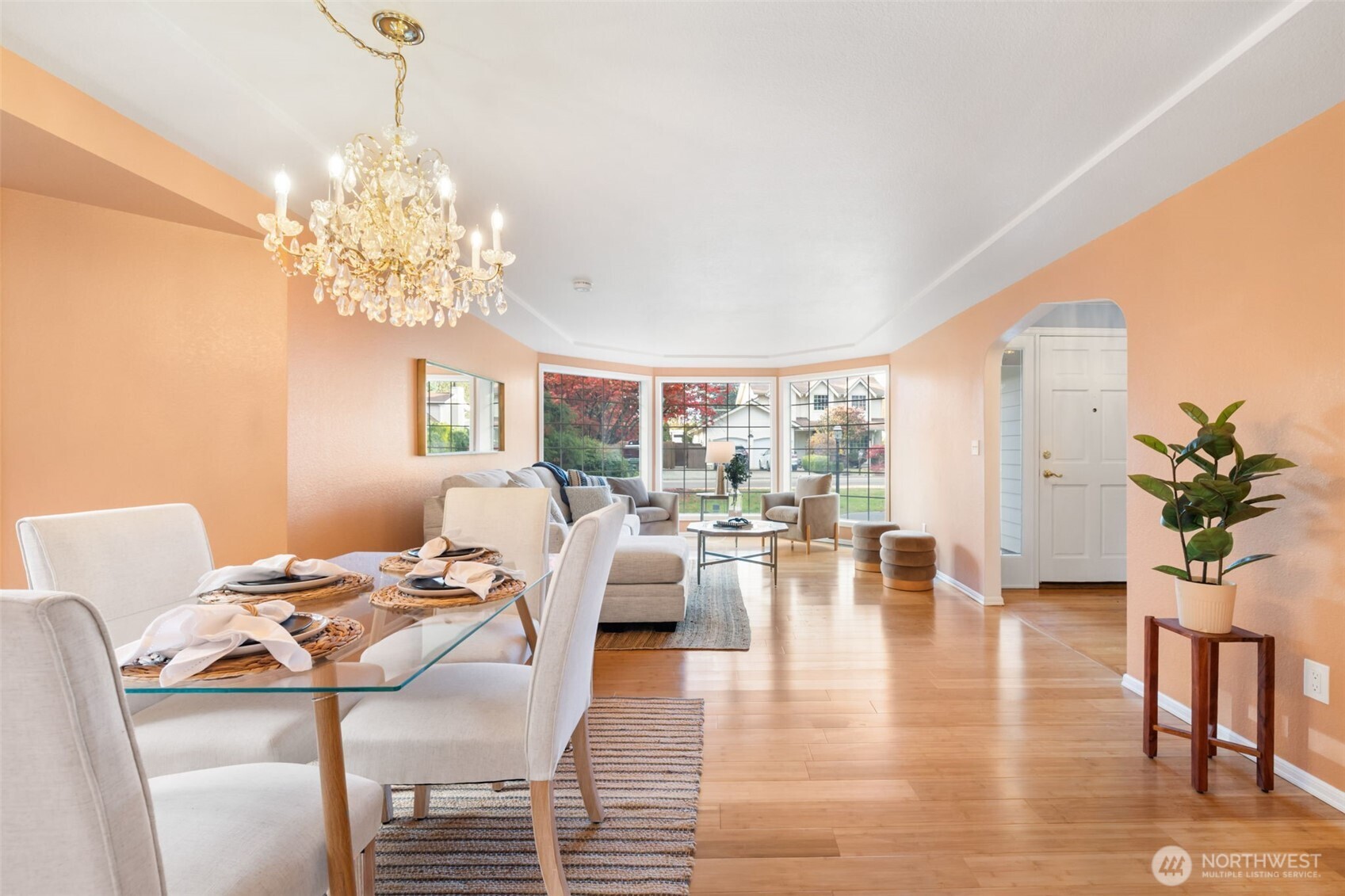 9220 78th Street Southwest Lakewood, WA 98498 - Photo 5 of 40 a view of a livingroom with furniture a chandelier and wooden floor