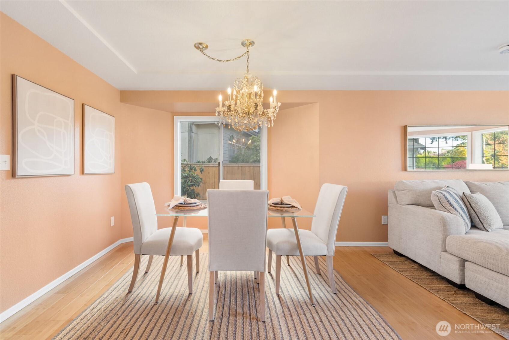 9220 78th Street Southwest Lakewood, WA 98498 - Photo 7 of 40 a view of a dining room with furniture a chandelier and wooden floor