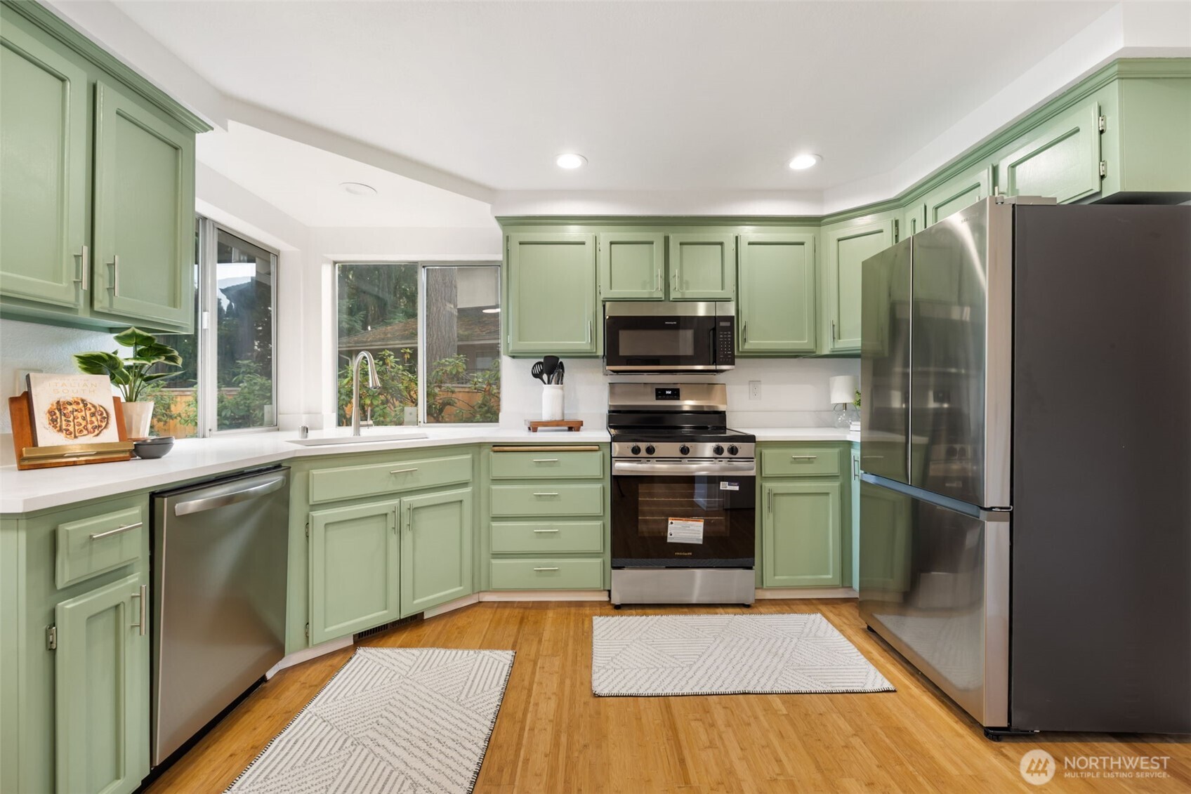 9220 78th Street Southwest Lakewood, WA 98498 - Photo 8 of 40 a kitchen with stainless steel appliances granite countertop a refrigerator stove and sink