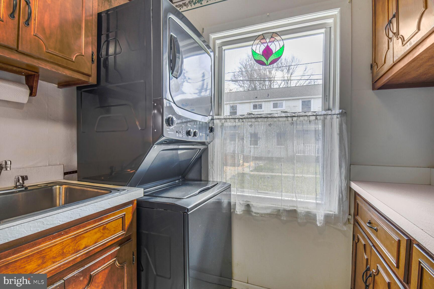 36 Ridge Road Greenbelt, MD 20770 - Photo 12 of 27 a kitchen with stainless steel appliances granite countertop a stove a sink and a microwave