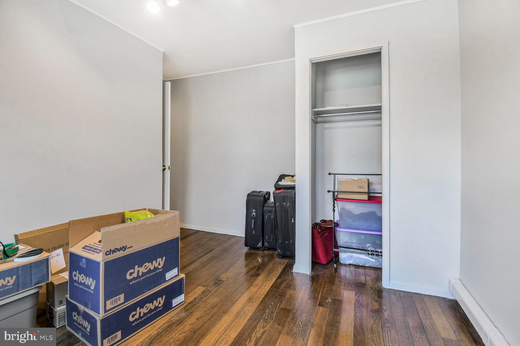 36 Ridge Road Greenbelt, MD 20770 - Photo 15 of 27 a room with wooden floor and shoes