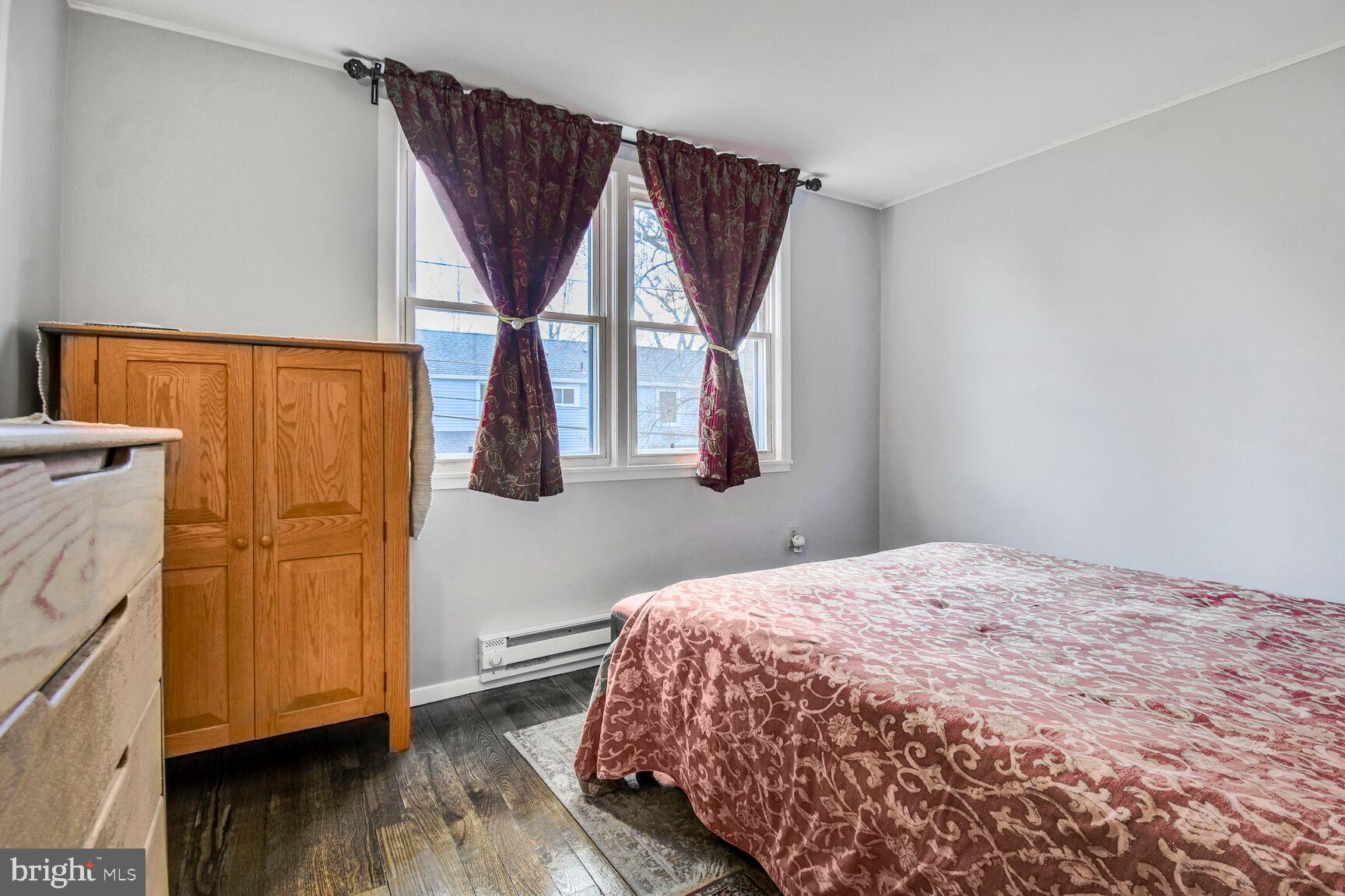 36 Ridge Road Greenbelt, MD 20770 - Photo 16 of 27 a bedroom with a bed and a window