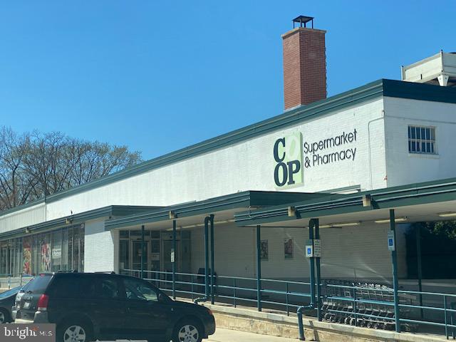 36 Ridge Road Greenbelt, MD 20770 - Photo 21 of 27 a front view of a building with parking area
